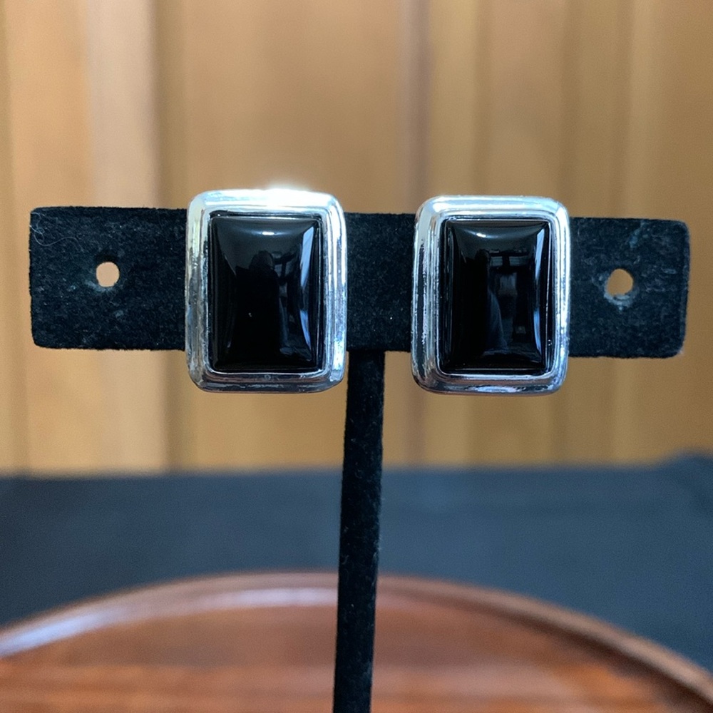Roman silver tone and black clip on earrings